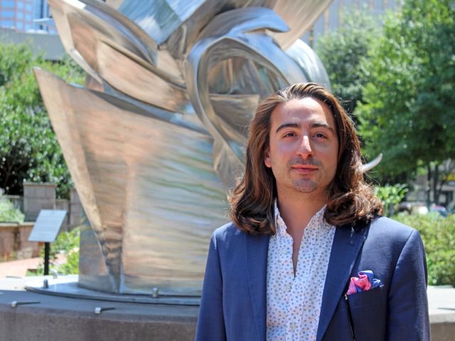 A headshot of Adam Santalla Pierce.